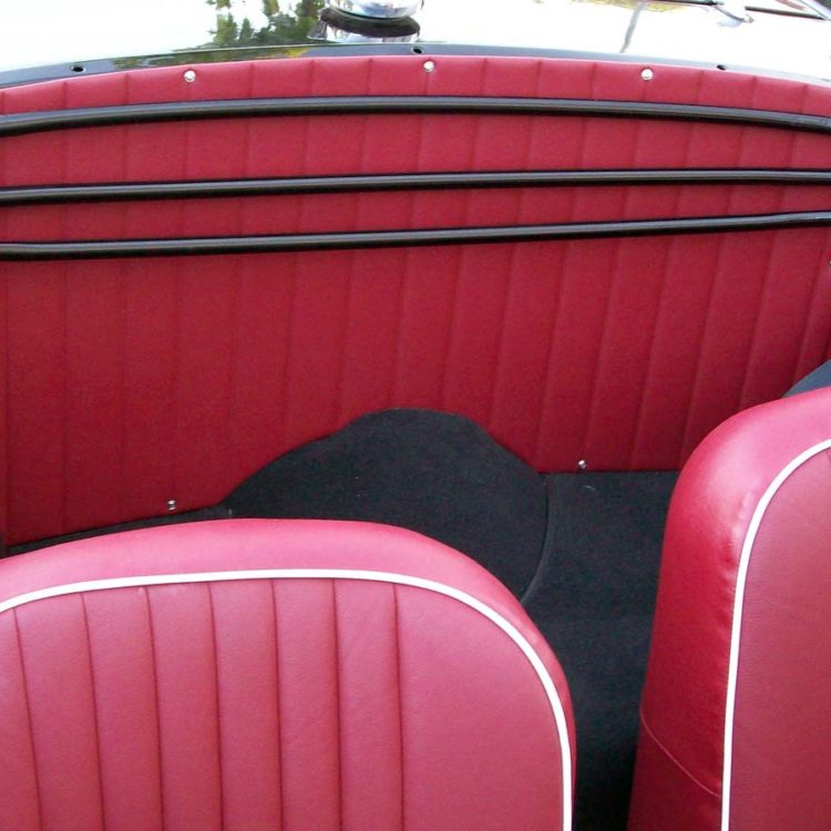 Triumph TR4 fitted with Matador Red Vinyl Rear Bulkhead Panel, LeatherFaced Front Seats ("Late Style"), and Black Nylon Carpets.