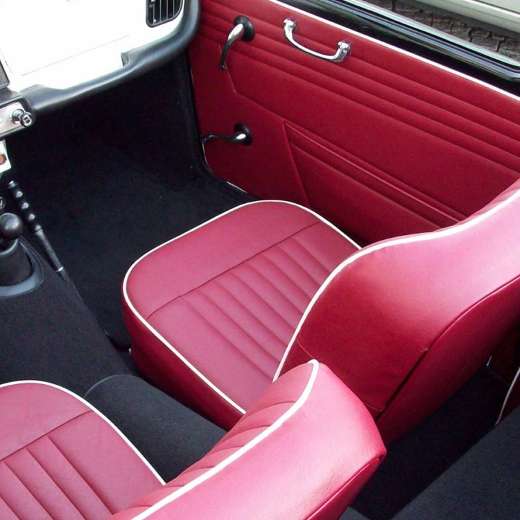 Triumph TR4 fitted with Matador Red Vinyl Trim Panels, LeatherFaced Seats ("Late Style") and Black Nylon Carpets.