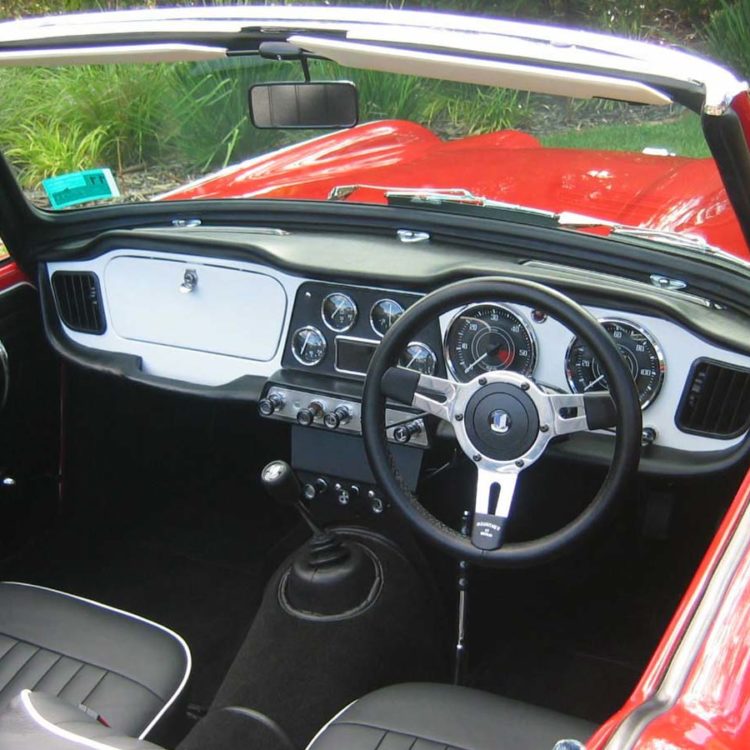 Triumph TR4 fitted with a Black Vinyl Interior Trim Panels, LeatherFaced Front Seat Covers, and White PVC Sunvisors.