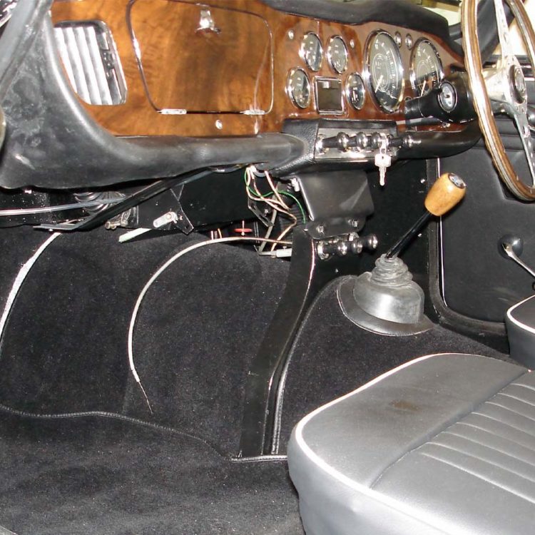 Triumph TR4 fitted with a Black Vinyl Door Panels, LeatherFaced Front Seats, and Black Wool Carpets.