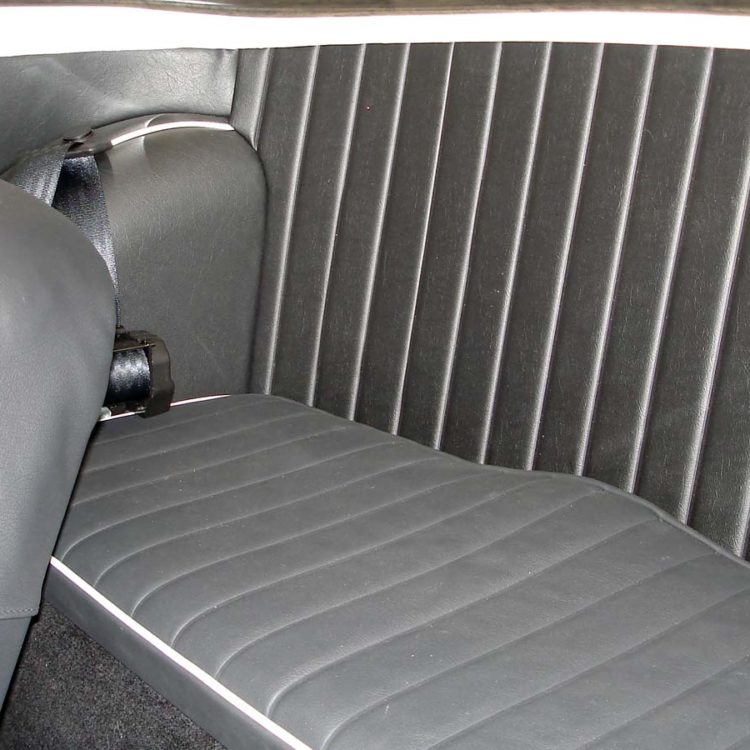 Triumph TR4 fitted with a Black Vinyl Interior Bulkhead Panel, Quarter Panels, and LeatherFaced Front & Rear Seats.