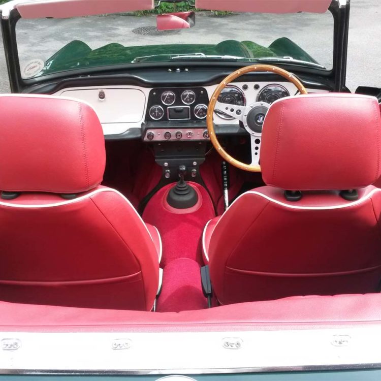 Triumph TR4 fitted with Cherry Red Vinyl 3pc Hood Frame Stowage, with Red Wool Carpets.