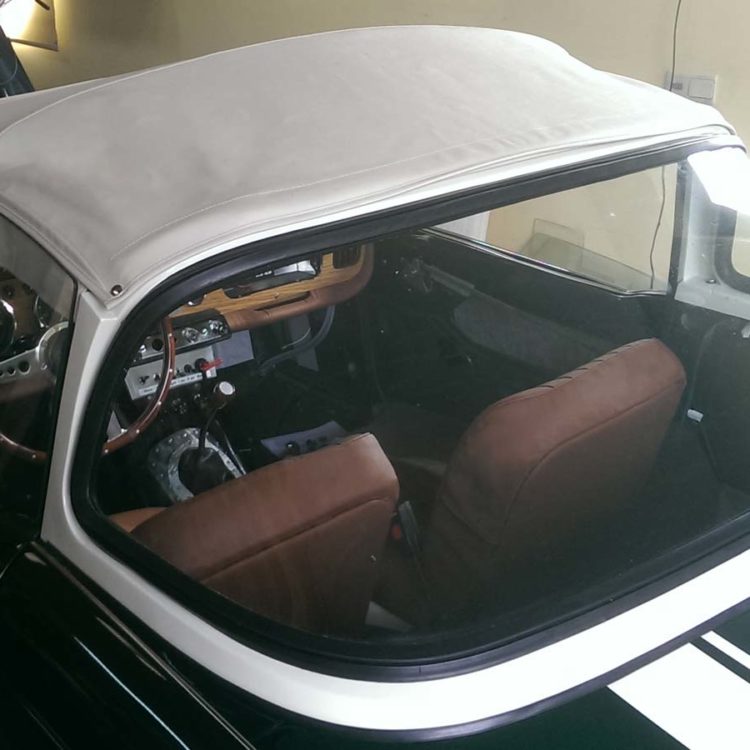 Triumph TR4 fitted with a White PVC Everflex Surrey Top Canopy Cover.
