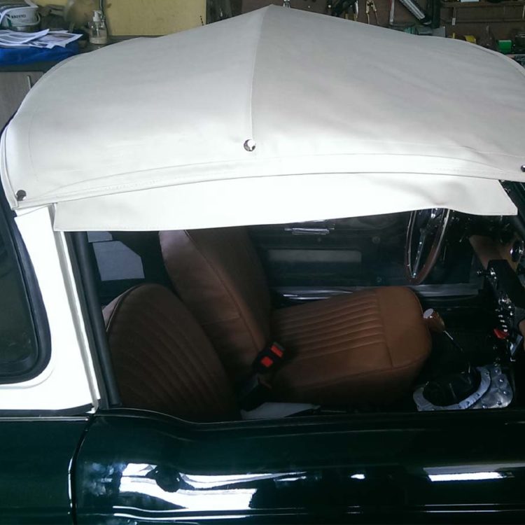 Triumph TR4 fitted with a White PVC Everflex Surrey Top Canopy Cover.