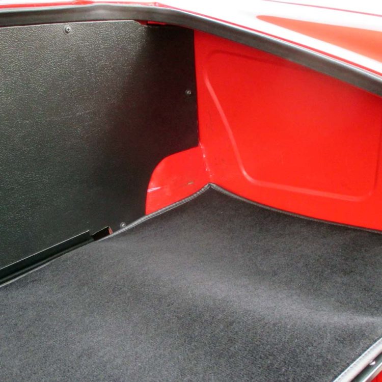 Triumph TR4 fitted with a Black Wool Boot Mat Carpet, and Blackgrain Millboard Fuel Tank Board.
