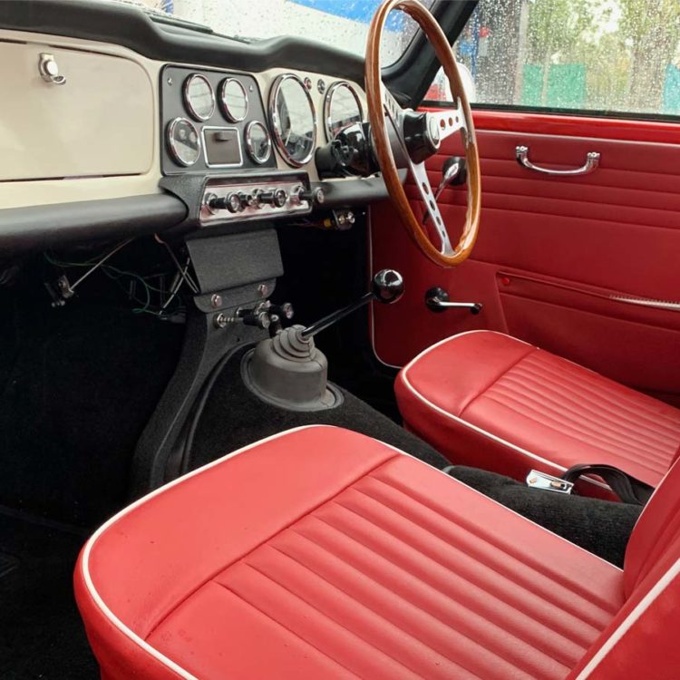 Triumph TR4 fitted with Cherry Red Vinyl Door Panels and Front Seat Covers ("Late Style").
