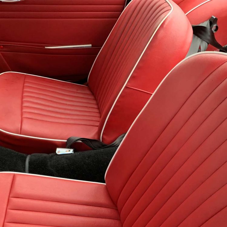 Triumph TR4 fitted with Cherry Red Vinyl Trim Panels and Front Seat Covers ("Late Style").