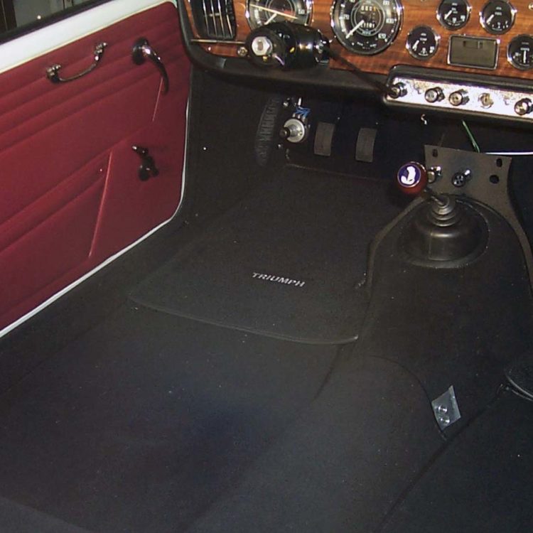 Triumph TR4 fitted with Matador Red Vinyl Panels, and a Black Wool Carpet Set, with Triumph Overmats.