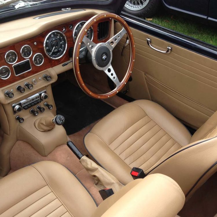 Triumph TR4A fitted with Barley Beige LeatherFaced Seats & Headrests (TR6), Vinyl Door Panels & Dash Console Area, with Cinnamon Wool Carpets.