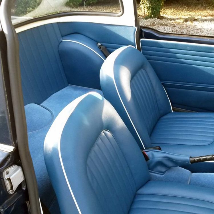Triumph TR4A fitted with Midnight Blue Vinyl Interior Trim Panels, and Front Seat Covers, with Shadow Blue Wool Carpets.