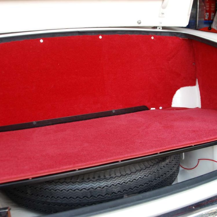 Triumph TR4A fitted with Bright Red Wool Boot Trunk Carpet, and Wool Trimmed Trunk Side Panels & Petrol Tank Board.