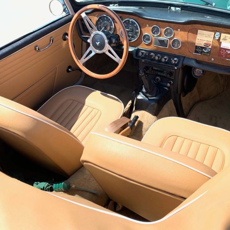 Triumph TR4A fitted with Biscuit Light Tan Vinyl Door Trims, and Hood Frame Cover, with LeatherFaced Front Seat Covers.