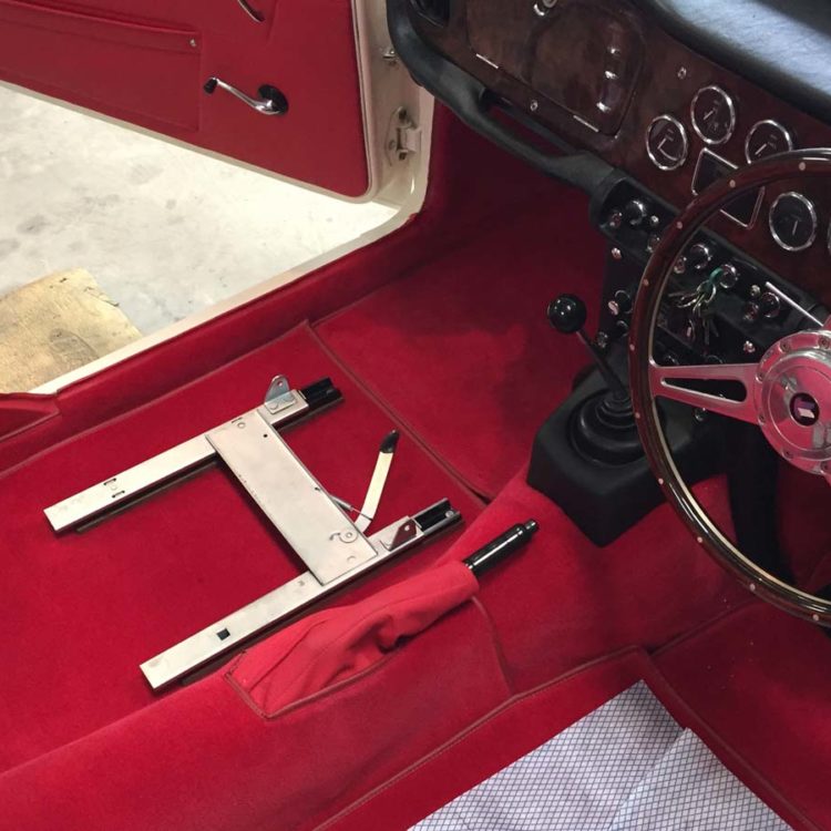 Triumph TR4A fitted with Bright Red Wool Carpet Set, and Leather Handbrake Cover, and B Post Finisher Panels.