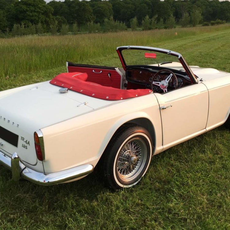 Triumph TR4A fitted with Bright Red Leather Interior Trim Panels and Hood Frame Cover.