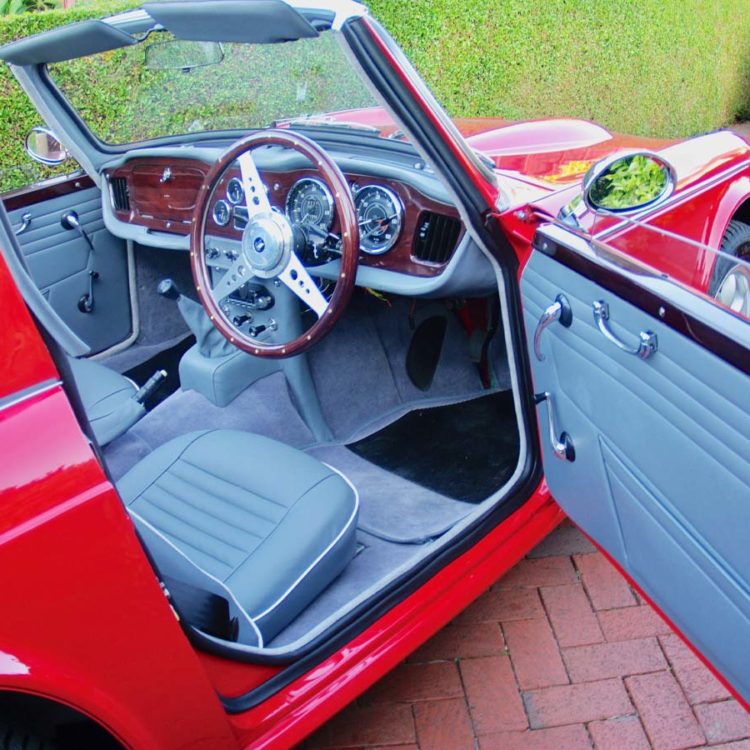 Triumph TR4A fitted with French Blue Vinyl Door Panels, Sunvisor Units, LeatherFaced Front Seats (TR6), and Saville Grey Wool Carpets.