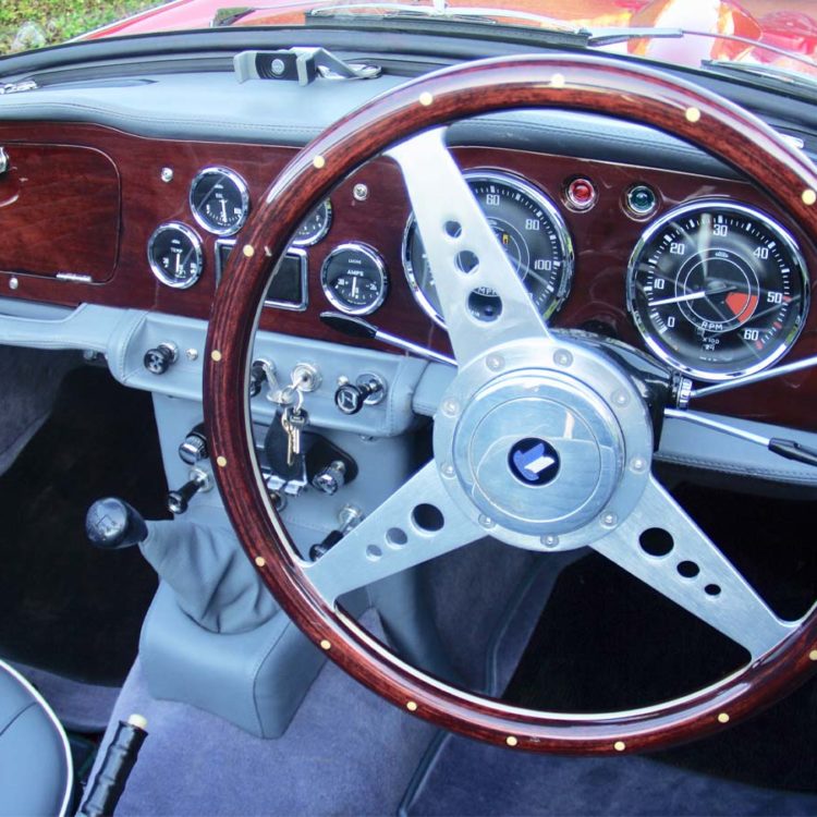 Triumph TR4A fitted with a French Blue Vinyl Dash Top Crashroll, Lower Crashpads, Switch Plinth, and Centre Console H Frame Assembly.