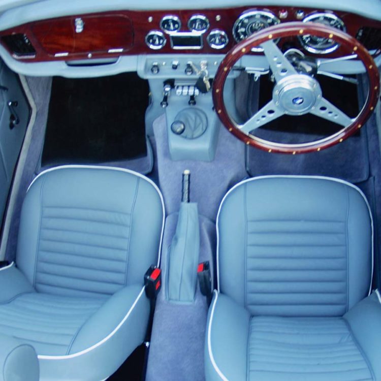Triumph TR4A fitted with French Blue Vinyl Trim Panels, Dash Area. LeatherFaced Front Seats (TR6), and Saville Grey Wool Carpets.