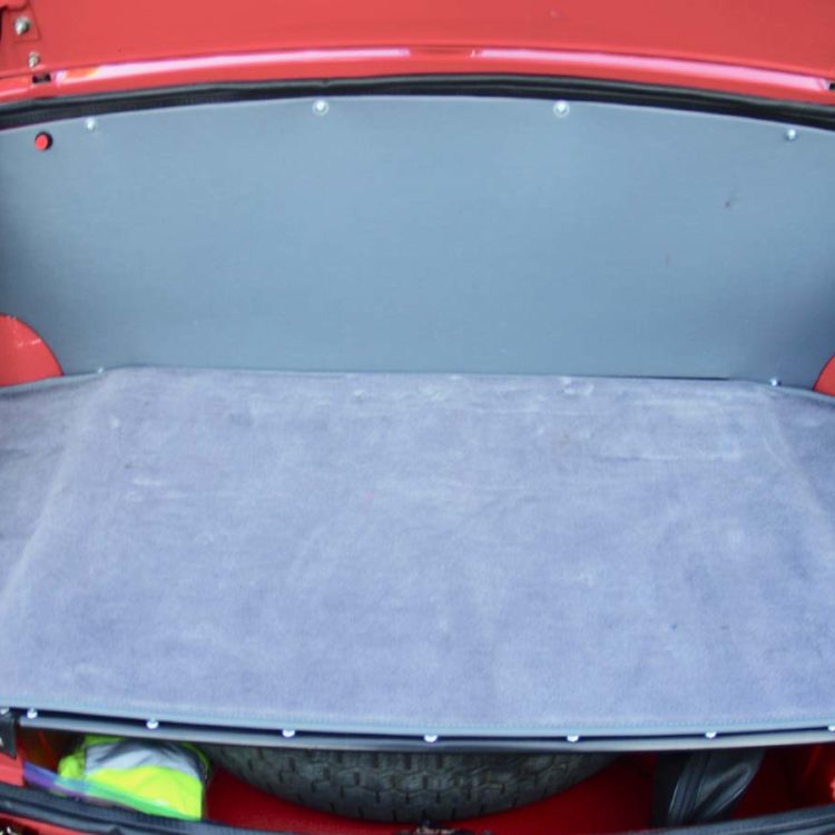 Triumph TR4A fitted with French Blue Vinyl trimmed Boot Trunk Liner Panel, and Side Panels, with a Saville Grey Wool Mat