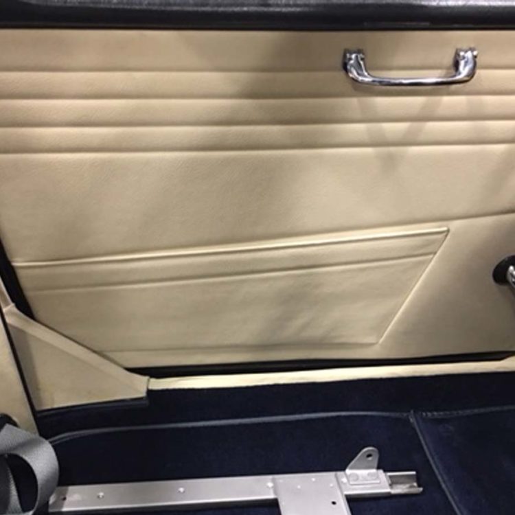 Triumph TR4A fitted with Parchment Leather Door Panels & Quarter Post Trims, and Dark Blue Wool Carpets.