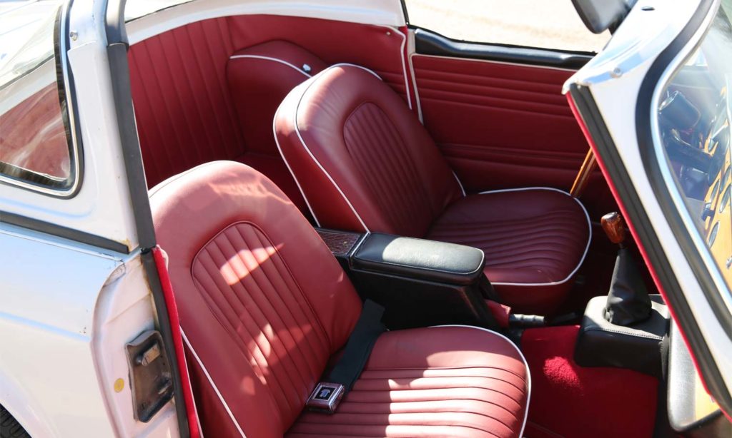 Triumph TR5 / TR250 fitted with Matador Red Vinyl Interior Trim Panels, LeatherFaced Front Seats, and a Red Wool Carpet Kit.