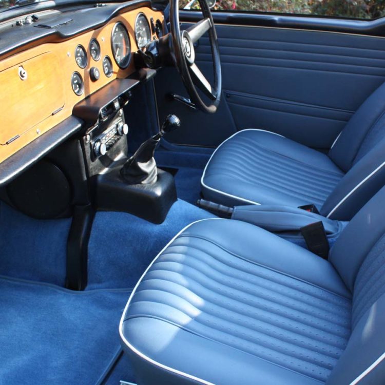 Triumph TR5 / TR250 fitted with Shadow Blue Vinyl Interior Trim Panels, Front Seat Covers, and Shadow Blue Wool Carpets.