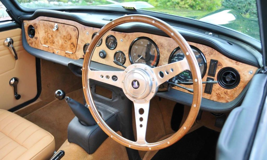 Triumph TR5 / TR250 fitted with Ferrari Beige Interior Trim Panels, Black Leather Dash & Crashpad & Console Kit, and Palomino Wool Carpets.