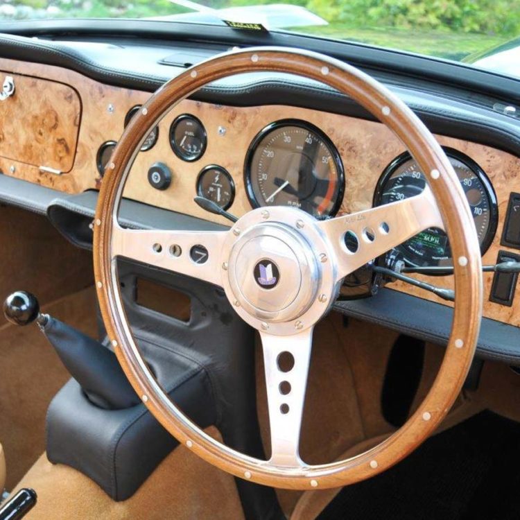 Triumph TR5 / TR250 fitted with Ferrari Beige Interior Trim Panels, Black Leather Dash & Crashpad & Console Kit, and Palomino Wool Carpets.