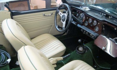 Triumph TR5 / TR250 fitted with Stone Vinyl Interior Trim Panels, Front Seat Covers and Dark Green Nylon Carpets.