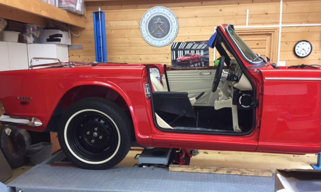 Triumph TR5 / TR250 fitted with Parchment Leather Interior Trim Panels, Dash & Console Area, and Black Wool Carpets.
