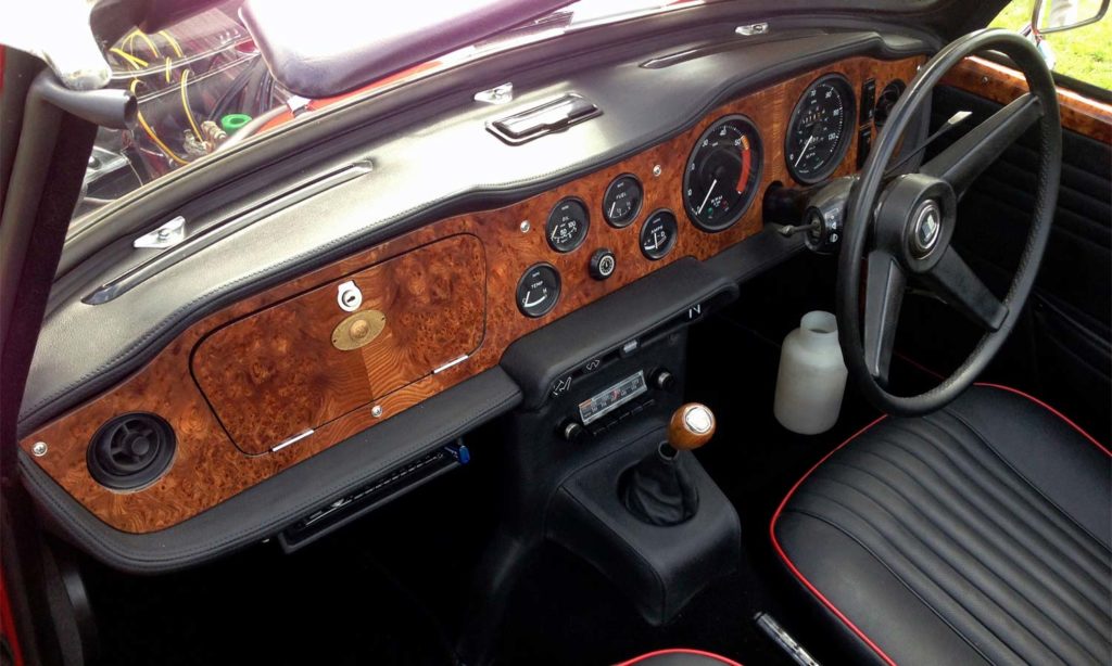 Triumph TR5 / TR250 fitted with a Black Leather Dash Top Crashroll, Lower Crashpad Covers, Switch Plinth Housing and H Frame Console Kit.