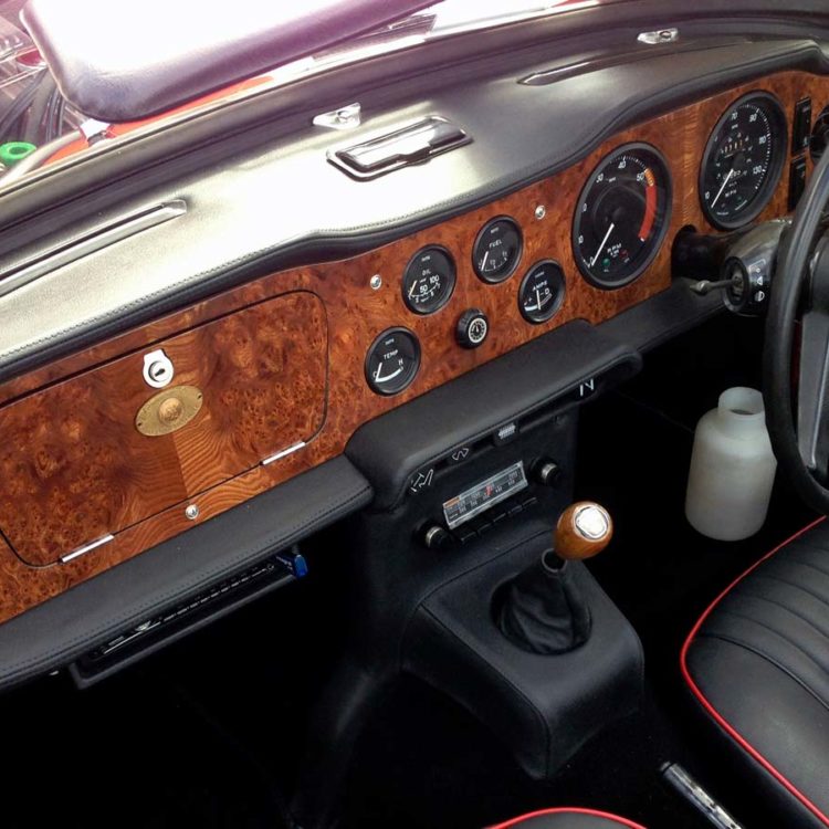 Triumph TR5 / TR250 fitted with a Black Leather Dash Top Crashroll, Lower Crashpad Covers, Switch Plinth Housing and H Frame Console Kit.