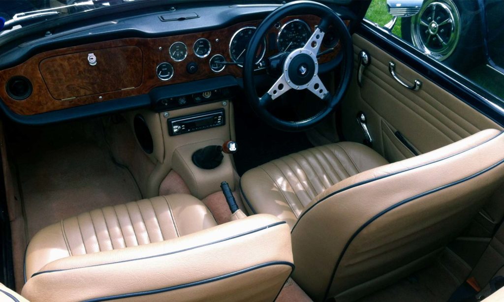 Triumph TR5 / TR250 fitted with Barley Beige Vinyl Trim Panels & Centre Console H Frame, LeatherFaced Front Seats, and Cinnamon Wool Carpets.
