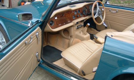 Triumph TR5 / TR250 fitted with Barley Beige Vinyl Trim Panels, Dash & Console Area, Front Seat Covers, and Honey Wool Carpets.