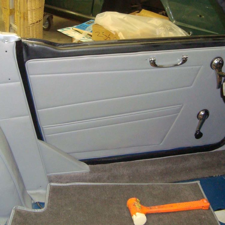 Triumph TR6 fitted with Saville Grey Vinyl Interior Trim Panels, and Dark Grey Nylon Carpets.