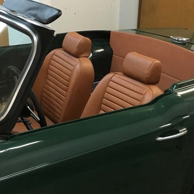 Triumph TR6 fitted with New Tan "RG" Vinyl Rear Bulkhead Panel, and Front Seat & Headrest Covers.