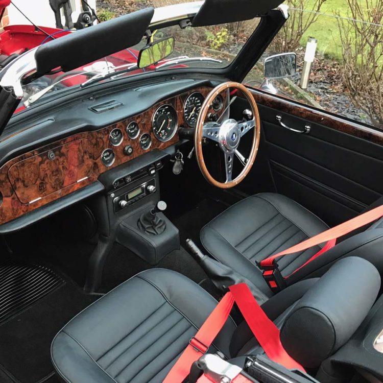 Triumph TR6 fitted with Black Leather Interior Trim Panels, Centre Console H Frame, & Front Seat & Headrest Covers (CF/CR), with Black PVC Sunvisors.