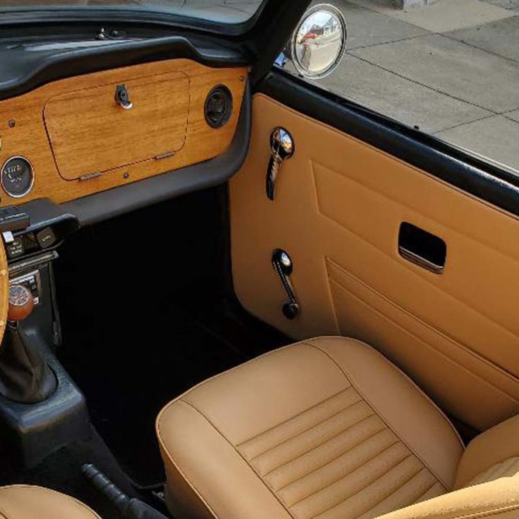Triumph TR6 fitted with Biscuit Light Tan Vinyl Interior Trim Panels, Front Seats Covers & Headrests (CF/CR), and Black Wool Carpets.