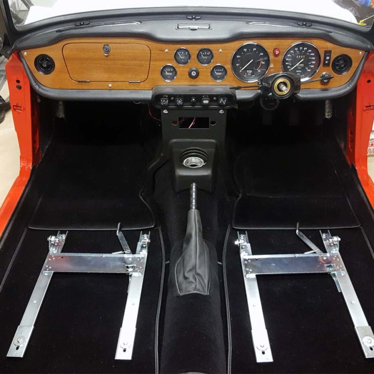 Triumph TR6 fitted with a Black Wool Carpet Set, and a Leather Handbrake Cover.