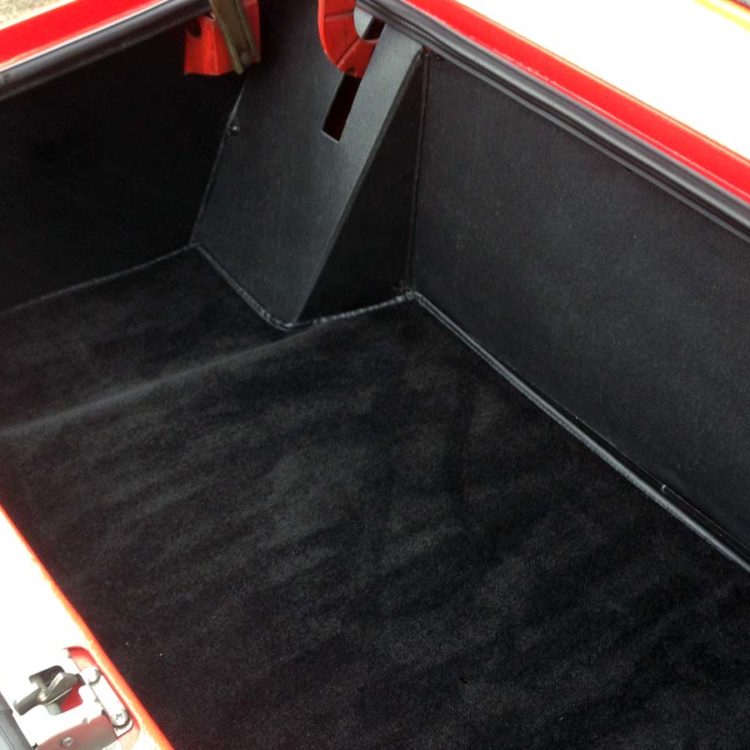 Triumph TR6 (Petrol Injection) fitted with Blackgrain Millboard Trunk Liner Panel Set, and a Black Nylon Trunk Mat.
