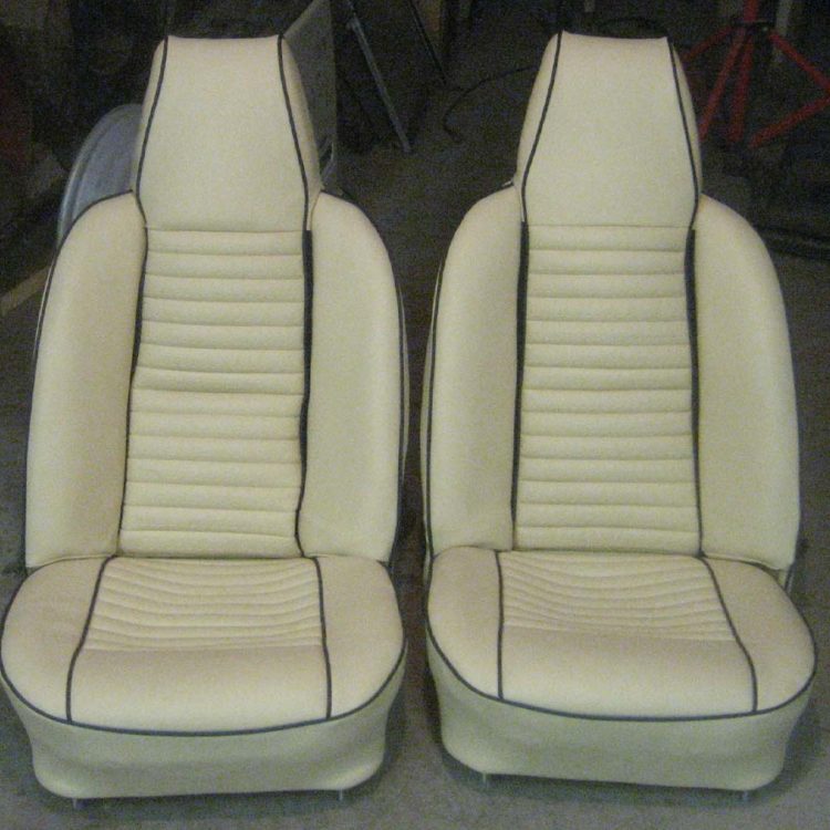 Triumph TR6 Front Seat Covers (Post CC50k+) fully trimmed in Magnolia Vinyl with Dark Blue Piping & Moquette Retainers.