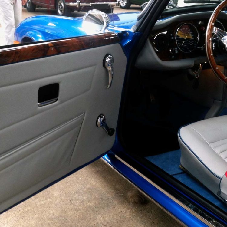 Triumph TR6 fitted with Grey Leather Interior Trim Panels, Front Seat Covers (CF/CR), and Shadow Blue Wool Carpets.
