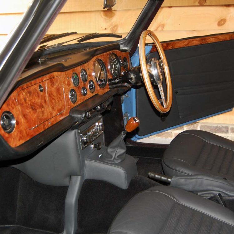 Triumph TR6 fitted with Black Leather Front Seat Covers (Embossed Pleats), Centre Console H Frame & Side Panels, and Black Wool Carpets.