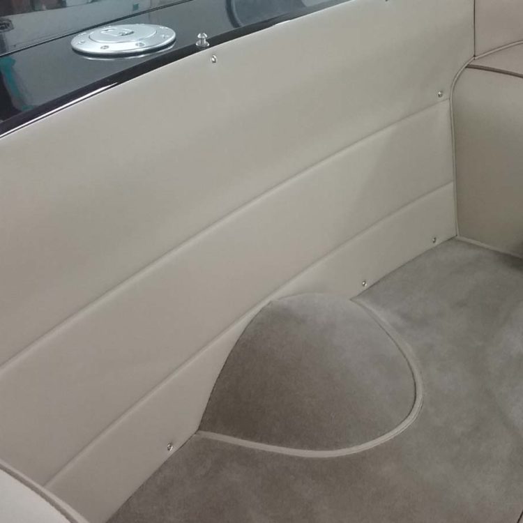 Triumph TR6 fitted with a Light Stone Beige Vinyl Rear Bulkhead Panel, Wheelarch Covers, and Fawn Wool Carpets.