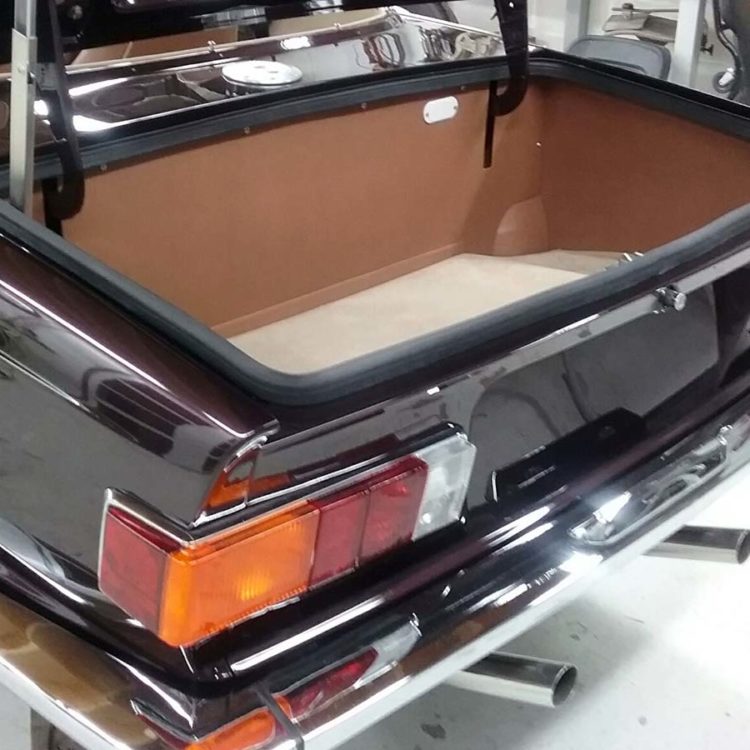 Triumph TR6 (Carb) Trunk Panel Kit trimmed with Cinnamon Vinyl, and Fawn Wool Boot Mat Carpet.