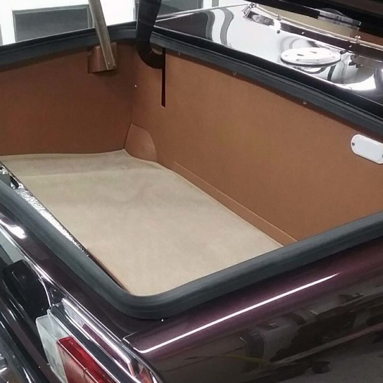 Triumph TR6 (Carb) Trunk Panel Kit trimmed with Cinnamon Vinyl, and Fawn Wool Boot Mat Carpet.