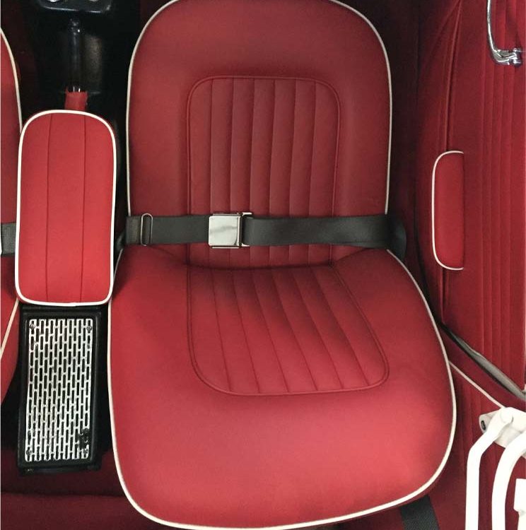 Triumph TR4A fitted with Bright Red Leather Front Seat Covers.