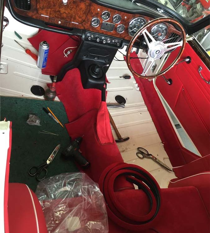Triumph TR4A fitted with Bright Red Leather Interior Trim Panels, and Wool Carpets, with Jute Felts.