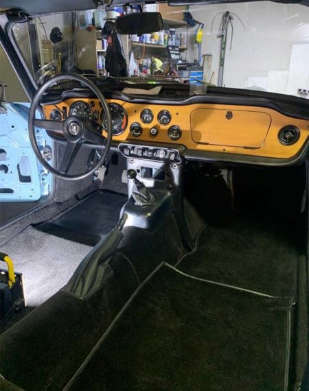 Triumph TR5 / TR250 fitted with a Black Nylon Carpet Set, with a Leather Handbrake Cover.