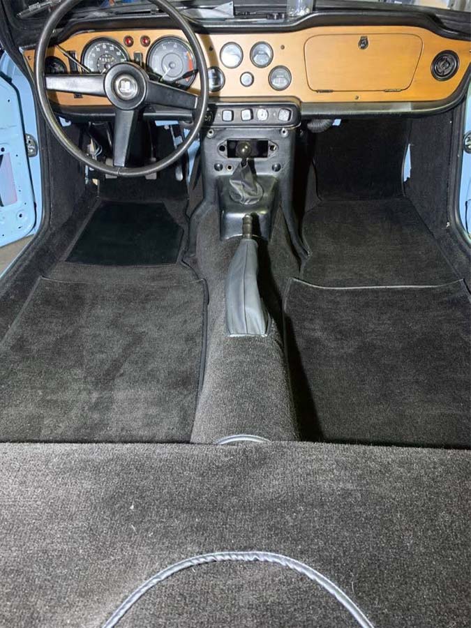 Triumph TR5 / TR250 fitted with a Black Nylon Carpet Set, with a Leather Handbrake Cover.