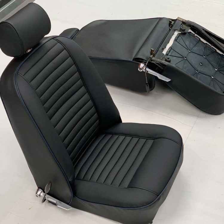 Triumph TR6 Front Seats & Headrests (CF/CR) fully trimmed in Black Leather & Vinyl Covers, with Embossed Pleated Panels.
